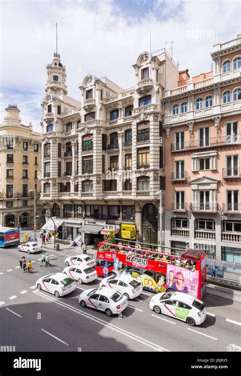 Madrids Grand Buildings And Madrid City Tour Bus Along Calle Gran Via