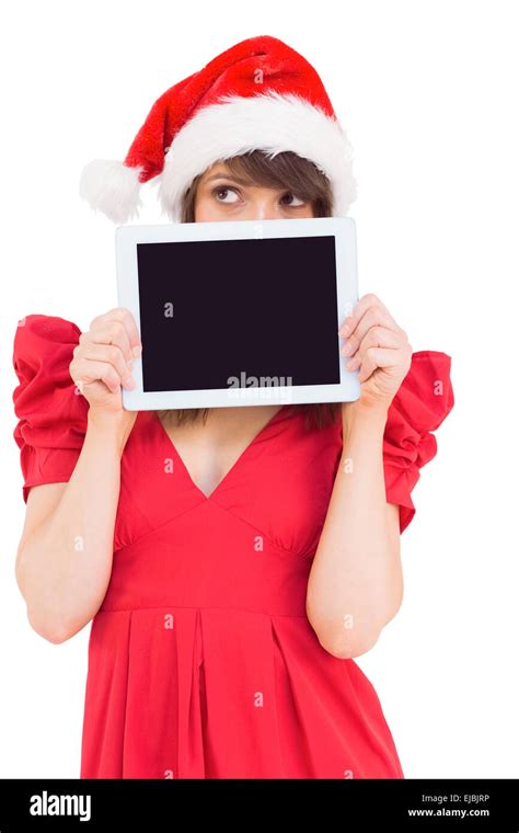 Festive Brunette Holding A Tablet Pc Stock Photo Alamy