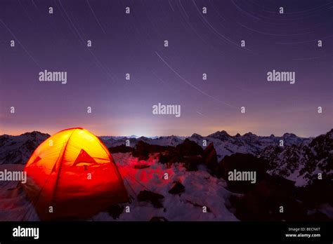 Illuminated Tent With View Over The Mountain Peaks Of The Oetztal Alps