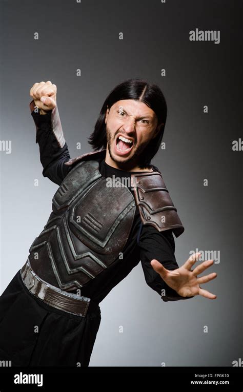 Angry Warrior Against Dark Background Stock Photo Alamy