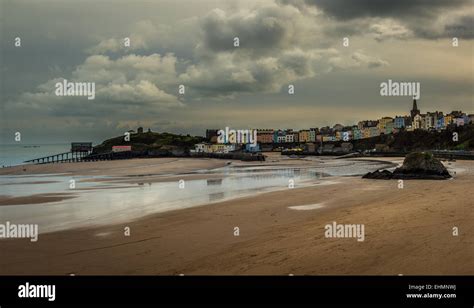 Tenby Harbour With Its Clusters Of Colourful Painted Houses And