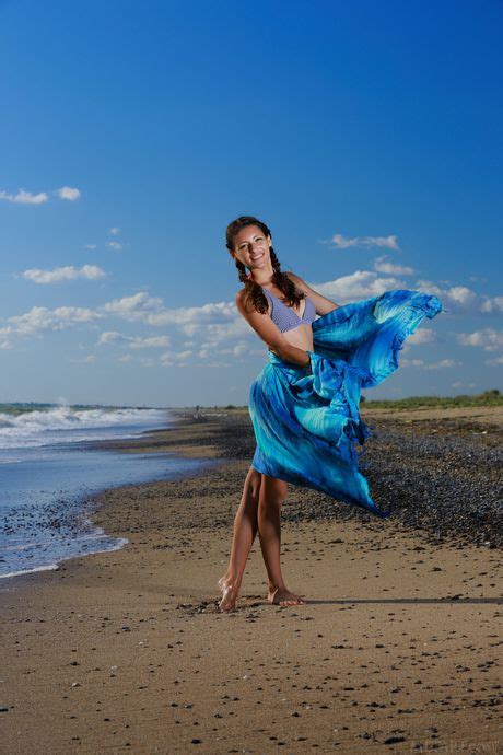 Russian Babe Rosella Gets Naked On The Beach And In The Water