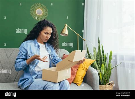 Dissatisfied Woman Buyer Received Wrong Parcel And Wrong Product Cheated Latina Woman Sitting
