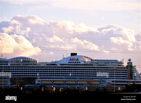 The Aida Cruise Ship Liner With A Towering Cumulonimbus Cloud In The