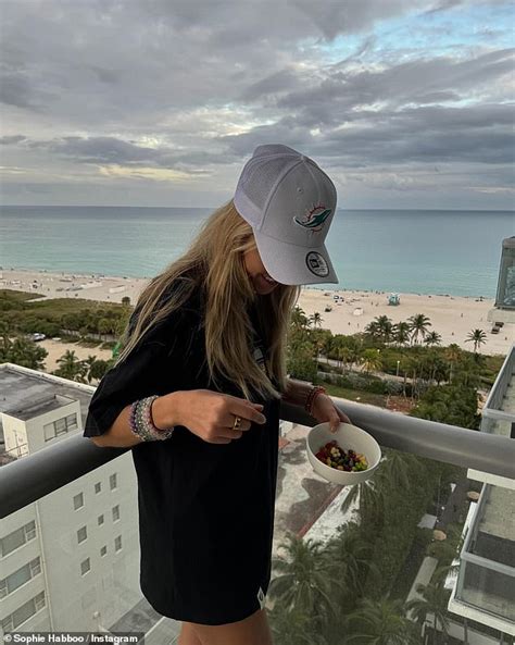 Sophie Habboo Flaunts Her Figure In A White Bikini And Crochet Sarong