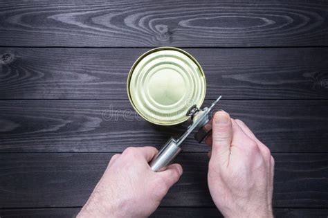 Man Opening Tin Canned Food Stock Photos Free Royalty Free Stock