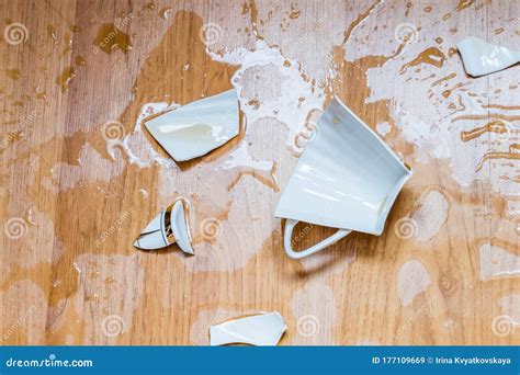 Broken Cup With Spilled Tea On A Floor Stock Image Image Of Utensils