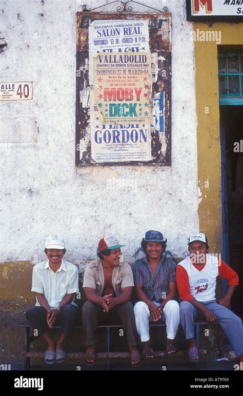 Four Men Sitting On A Bench In The Town Of Valladolid Yucatan Mexico