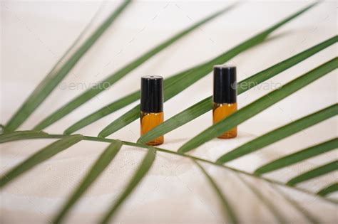 Blank Amber Glass Essential Oil Bottle On Natural Background Stock