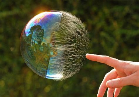 Slow motion picture sequence of bubble being popped | Geek Slop