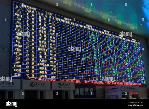 Beijing train station timetable in Beijing China Stock Photo - Alamy