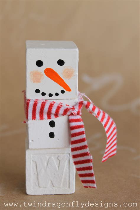 Adorable alphabet block snowman craft to make with the kids.