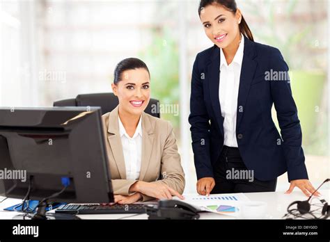 Portrait Of Beautiful Smiling Business Women In Office Stock Photo Alamy