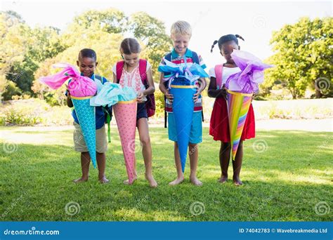 Kids Posing with Their Gift Surprise during a Sunny Day Stock Image ...