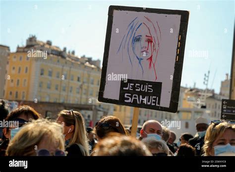 A protester holds a placard during the demonstration.Thousands have attended rallies across ...