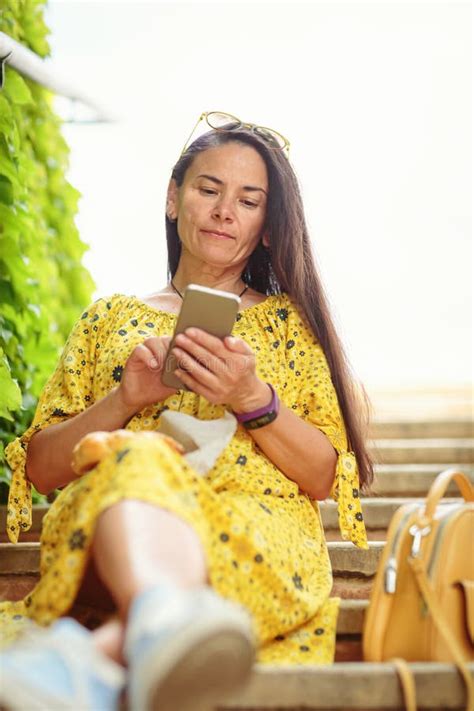 Attractive Brunette Woman Sitting On Stairs With Bagel Stock Image Image Of Appetizer
