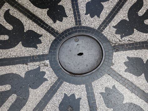 Man Hole Cover With Tulip Formed Decorations In Granito Stock Photo
