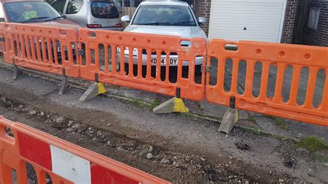 Cars trapped in driveways as road in Cornwall village of Probus dug up ...