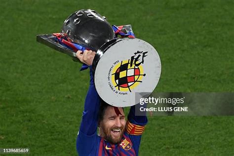 Barcelona's Argentinian forward Lionel Messi raises La Liga trophy as ...