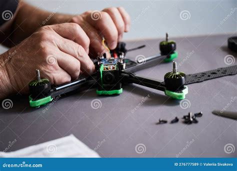 Close Up Of Man S Hands Assembling A Drone From Parts Using Tools Stock Image Image Of