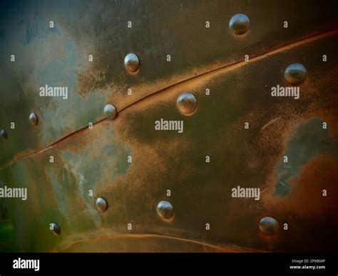 Metal Surface With Rivets And Bolts Abstract Background Of A Military