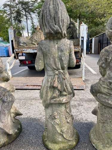 Stone Staues Of 3 Playful Children