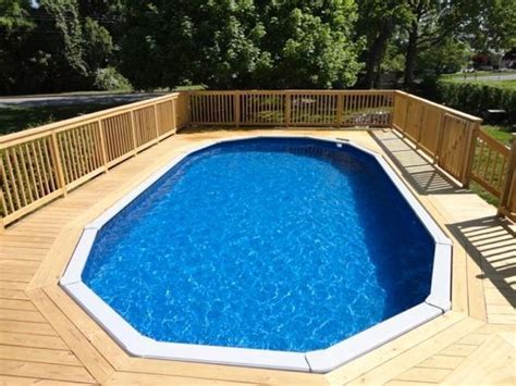 An Above Ground Pool Surrounded By Wooden Decking