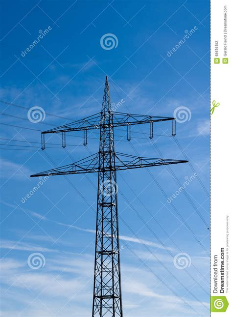 High Voltage Electricity Pylons Against Blue Sky Stock Photo Image Of