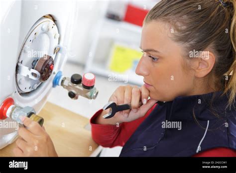 Female Technician Servicing A Boiler Stock Photo Alamy