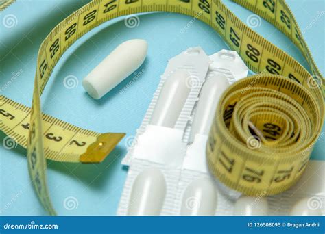Suppository For Anal Or Vaginal Use And Yellow Measuring Tape Candles