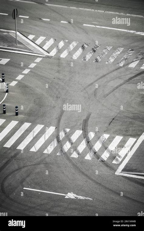Empty parking space, zebra crossing, tyre tracks, no car, markings