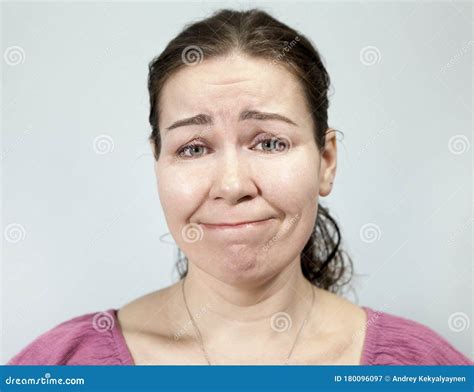 Confused Woman Pursed Lips Portrait On Grey Background Emotions