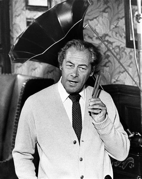 Rex Harrison Holds Up One Of His Tuning Forks As Professor Henry