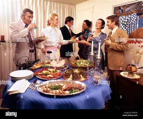 1970s Three Couples Men And Women At Buffet Dinner Party Eating