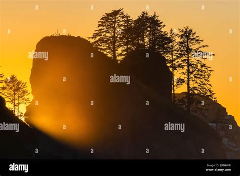 Sunset Glowing On Suspended Sea Spray And Sea Stacks At Point Of Arches