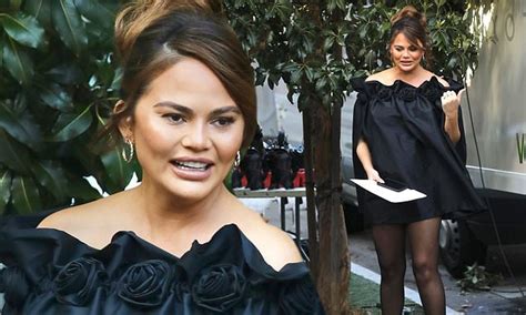 Chrissy Teigen Shows Off Her Toned Legs In A Stylish Black Dress As She