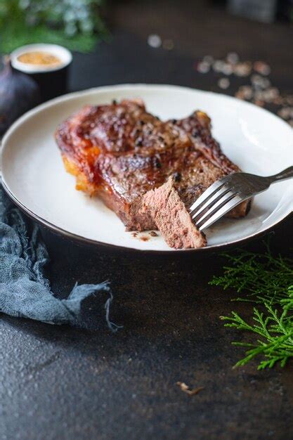 Premium Photo Grilled Beefsteak Ribeye On A White Plate