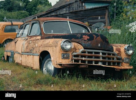 Old Abandoned And Forgotten Rusty Vintage Retro Car In Bad Condition