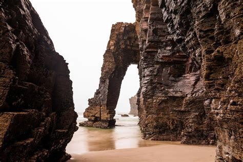 Premium Photo Natural Rock Arches On Cathedrals Beach In Low Tide Spain