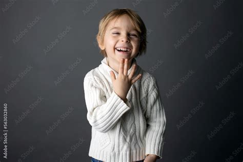 Cute little toddler boy, showing THANK YOU gesture in sign language on ...