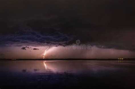 During A Thunderstorm Lightning Strikes The Ground Stock Photo Image