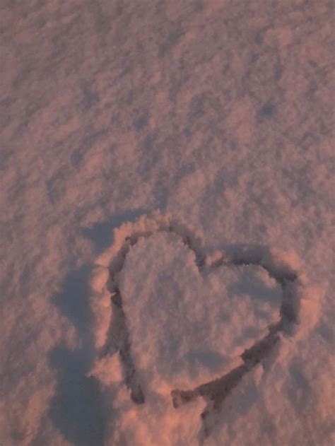 A Heart Drawn In The Snow On A Sunny Day