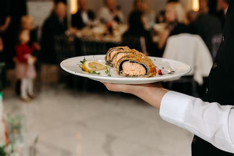 Premium Photo | Waiter serving food in restaurant