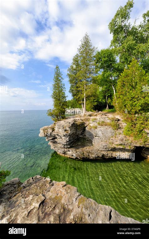 Tree Topped Cliffs And Rocky Points Along Scenic Lake Michigan At Cave