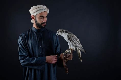 Premium Photo Young Arab Prince Holding A Bird Of Prey