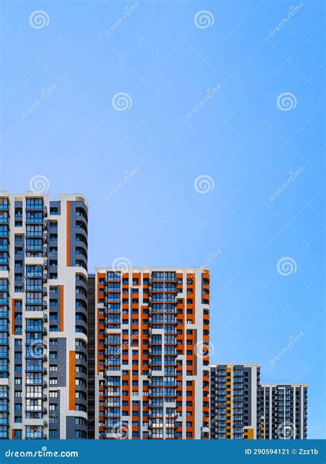 Freshly Built High Rise Apartment Buildings On Blue Sky Background