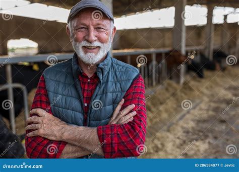 Farmer Standing In Front Of Cattle Ranch Stock Image Image Of Mature