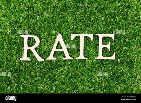 wood letter  word rate  green grass background stock photo alamy