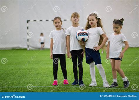 Children Playing Football Indoors. Girls Football Team Stock ...