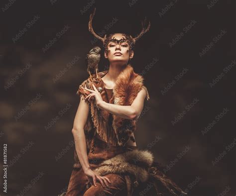 Zdj Cie Stock Woman Shaman In Ritual Garment With Hawk Adobe Stock